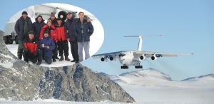 A large plane flies over an icy, mountainous landscape in Antarctica. Inset: a group of people in winter clothing pose together on the snow near the aircraft, supported by Antarctic Logistics and Expeditions.
