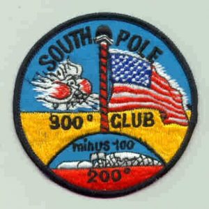 A circular patch reads South Pole 90° Club Minus 100° 200°, featuring a striped pole, U.S. flag, Antarctic landscape, and stylized sun—all celebrating Antarctica and Antarctic Logistics and Expeditions on a blue and yellow background.