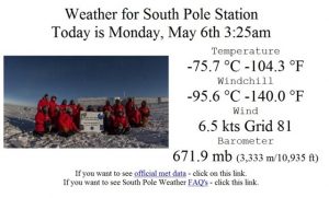 A group in red jackets poses on snow at South Pole Station, Antarctica, with weather details of –75.7°C and 6.5 kts wind at 3:25am on May 6th—part of an Antarctic Logistics and Expeditions adventure under a dark polar sky.