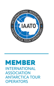 Logo of the International Association of Antarctica Tour Operators (IAATO), featuring an outline of Antarctica with IAATO and surrounding text, above the words Member International Association Antarctica Tour Operators.