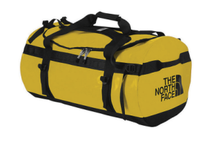 A large, yellow duffel bag with black straps and zippers, featuring THE NORTH FACE logo in black on the side—perfect for Antarctic Logistics and Expeditions or journeys to the South Pole.